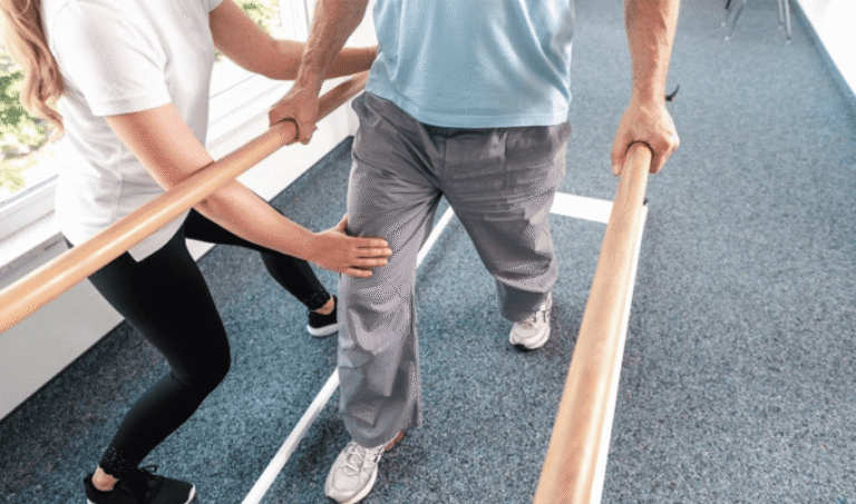 Patient holding a balance bar during neurophysical therapy at CNS Brain Center in Chicago for post-concussion rehabilitation