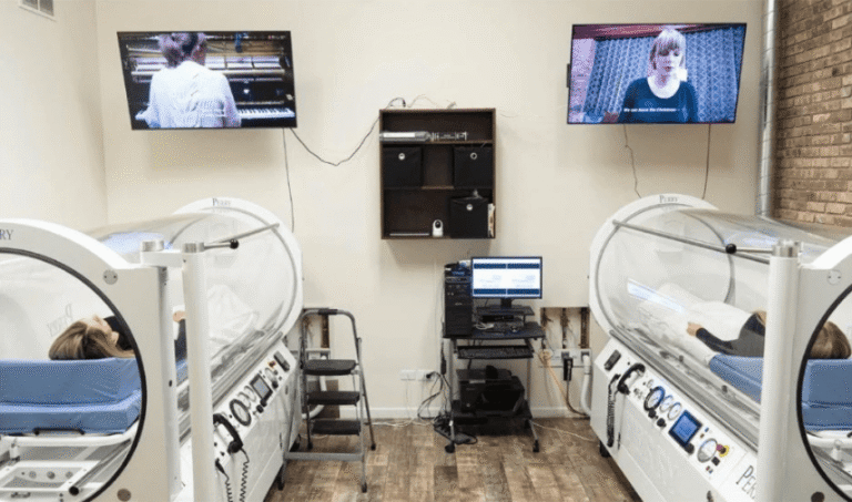Clear acrylic medical-grade HBOT chamber in a treatment room at CNS Brain Center Chicago